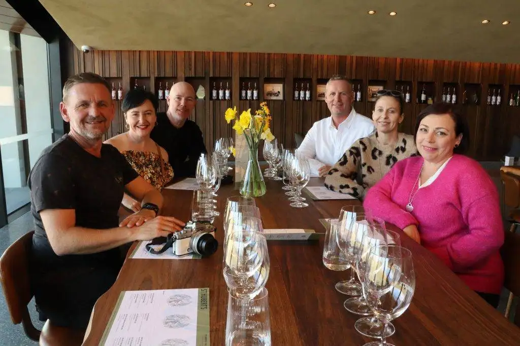 People tasting wine